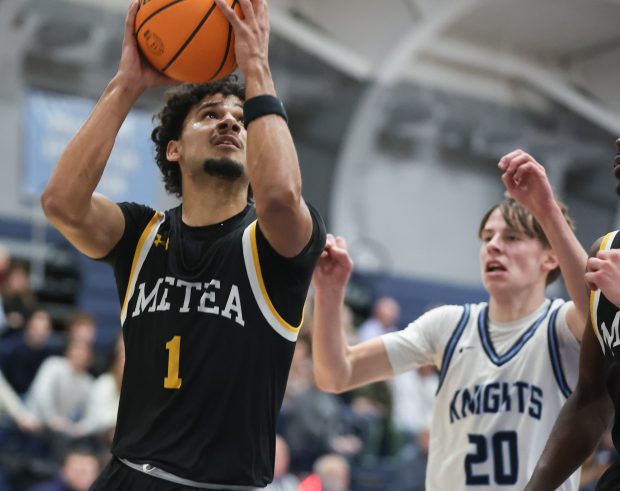 Metea Valley's Dominic Smith drives to the basket