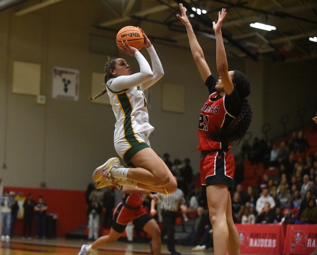 Waubonsie Valley's Danyella Mporokoso pulls up for a shot