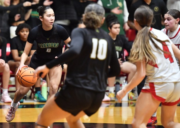 Waubonsie Valley's Maya Pereda looks for an open teammate