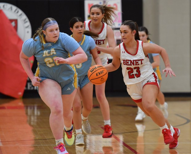 Benet's Brooke Bafia (23) takes off on a fast break as Joliet Catholic's Emma Birsa (21) races to defend her during a game on Wednesday, Feb. 5, 2025 in Lisle...(Jon Cunningham/for The Naperville Sun)