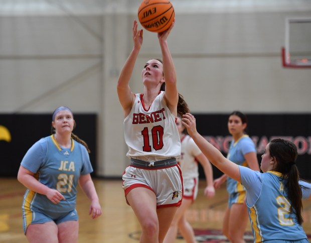 Benet's Kate Pohodich lays the ball up during a game against Joliet Catholic on Wednesday, Feb. 5, 2025 in Lisle...(Jon Cunningham/for The Naperville Sun)