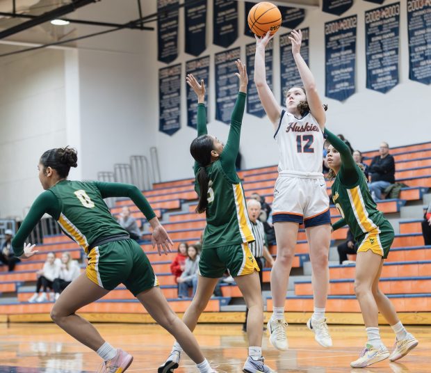 Naperville North's Anna Richards (12) shoots the ball against Waubonsie Valley during a DuPage Valley Conference game in Naperville on Thursday, Jan. 9, 2025. (Troy Stolt / for the Naperville Sun)