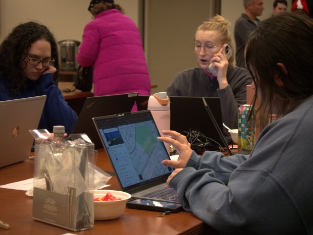 Lake County staff take calls and coordinate teams during the 2025 Point-in-Time Count Wednesday evening. The Central Permit Facility was the headquarters for the extensive volunteer effort. (Joe States/Lake County News-Sun)