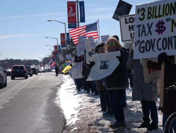 Hundreds of protesters line up in front of the Libertyville Tesla dealership, protesting Musk's outsized influence in government. It joins a wave of similar protest at Tesla dealerships across the country. (Joe States/Lake County News-Sun)