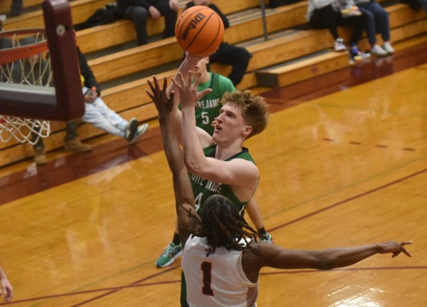 Notre Dame Prep's Brady Sehlhorst puts up a shot over Brother Rice's KJ Morris