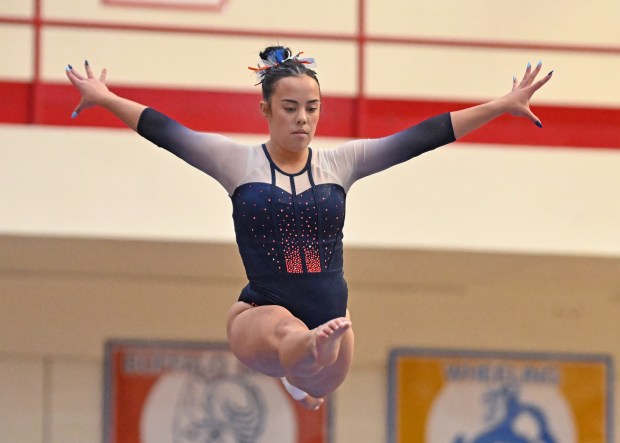 Oswego's Ava Sullivan performing on tae Balance Beam during Saturday's finals of the IHSA State Meet at Palatine High School, Feb. 22, 2025. (Brian O'Mahoney for the Chicago Tribune)