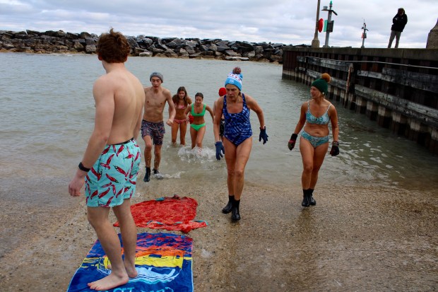 A group of hearty souls gathered at Forest Park Beach Saturday morning to plunge into the freezing waters of Lake Michigan for a cause. The Lake Forest/Lake Bluff Polar Plunge - Hearts for Honduras are raising funds for a second trip to the Agalta Valley of Honduras to volunteer in schools and communities to help families there secure clean drinking water. (Gina Grillo/ for the Pioneer Press)