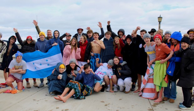 A group of hearty souls gathered at Forest Park Beach Saturday morning to plunge into the freezing waters of Lake Michigan for a cause. The Lake Forest/Lake Bluff Polar Plunge - Hearts for Honduras are raising funds for a second trip to the Agalta Valley of Honduras to volunteer in schools and communities to help families there secure clean drinking water. (Gina Grillo/ for the Pioneer Press)