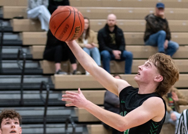 Illiana Christian's Noah Sons goes for a layup