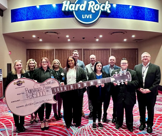 Hard Rock Casino Northern Indiana recently donated $25,000 to the Raindrops Rising Foundation in honor of National Human Trafficking Awareness Month. On hand for the presentation were, from left, Alice Cross, treasurer, Raindrops Rising Foundation; Christine Rury, VP of Human Resources, Hard Rock Casino Northern Indiana; Jess Kern, president and founder, Raindrops Rising Foundation; Gayl Baker, VP of Finance, Hard Rock Casino Northern Indiana; Jazmen Stutz, vice president, Raindrops Rising Foundation; Patrick Brown, Vice President of Food & Beverage, Hard Rock Casino Northern Indiana; Matt Schuffert, president, Hard Rock Casino Northern Indiana; Alicia Barnes, community outreach, Raindrops Rising Foundation; Joseph Branchik, VP of Marketing, Hard Rock Casino Northern Indiana; Becky Lampa, secretary, Raindrops Rising Foundation; and Jamie Harris, VP of Security, Hard Rock Casino Northern Indiana. (Photo courtesy of Hard Rock Casino Northern Indiana)