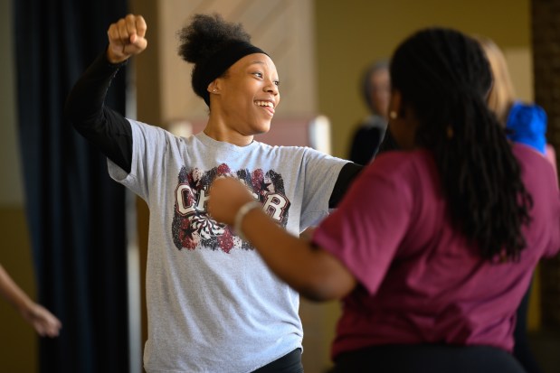 Thea Bowman cheerleading and dance team members dance "Soul Train" style in pairs during a visit from Dance Theatre of Harlem members at Indiana University Northwest on Tuesday, Feb. 25, 2025. (Kyle Telechan/for the Post-Tribune)