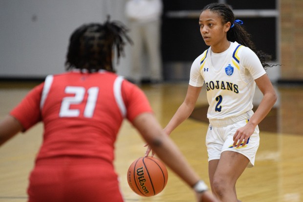 Highland guard Savannah Ballard heads upcourt past East Chicago guard Keirra Standfield during the Class 3A Griffith Sectional championship game on Saturday, Feb. 8, 2025. (Kyle Telechan/for the Post-Tribune)