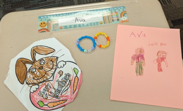 Bailey Elementary students left drawings and handmade bracelets on the desk of their classmate, Ava Payne, who died Friday from gunshot wounds in a tragedy that took the lives of her two sisters, and mother. Authorities found their father, Robert Payne, dead from a self-inflicted wound. (Carole Carlson/Post-Tribune)