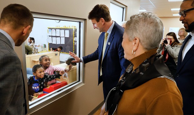 U.S. Rep. Frank Mrvan, D-Highland, (center) greets a child as the Geminus Head Start welcomed him to the St. Mark Early Learning Academy in Gary. Mrvan held a press conference and toured the Learning Academy to set the record straight on Trump's federal funding freeze and its impact on Head Start programs on Thursday, Feb. 20, 2025. (John Smierciak / Post-Tribune)