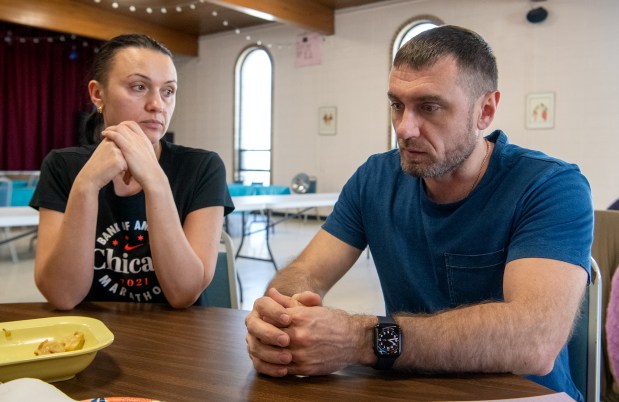 Oksana Kushnir looks at her husband Pastor Volodymyr Kushnir at the St. Josaphat Ukrainian Catholic Church in Munster, Indiana Friday Feb. 21, 2025.(Andy Lavalley for the Post-Tribune)