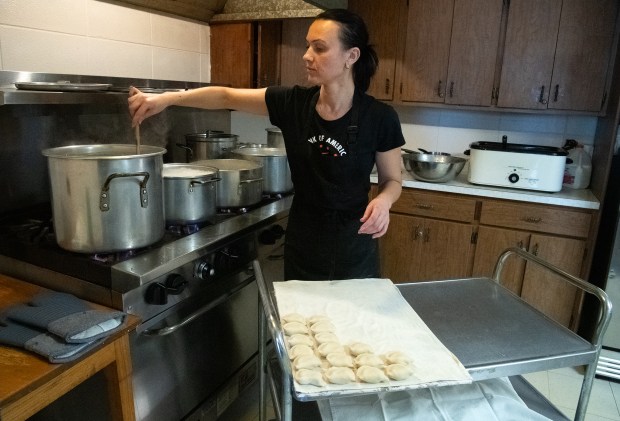 Oksana Kushnir boils pierogies at the St. Josaphat Ukrainian Catholic Church in Munster, Indiana on Friday, Feb. 21, 2025. Kushnir is the wife of Pastor Volodymyr Kushnir. (Andy Lavalley for the Post-Tribune)