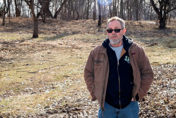 City of Valparaiso parks & recreation horticultualist Steve Martinson stands in an area cleared of overgown invasive species at Valparaiso's Rogers Lakewood Park on Monday, Feb. 10, 2025. (Michael Gard/for the Post-Tribune)