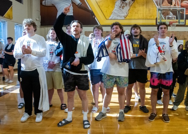 A group of students take part in the pre-jump ceremonies prior to the Polar Plunge for Special Olympics Indiana outside the Athletics-Recreation Center at Valparaiso University Saturday, Feb. 22, 2025. (Andy Lavalley/for the Post-Tribune)