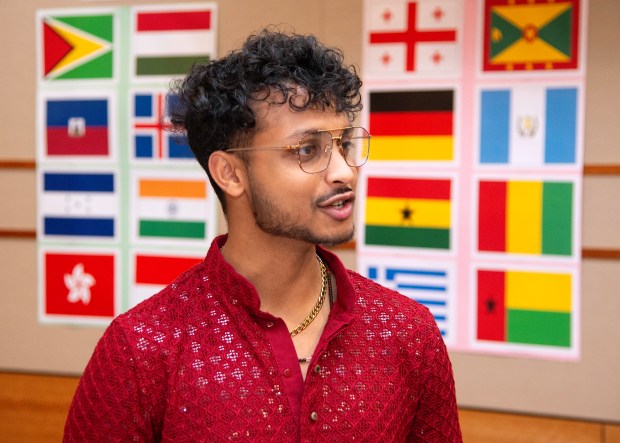 Anand Agrawal, originally from Kathmandu, Nepal, discusses about the Valparaiso International Student Association's 45th annual World Banquet at Valparaiso University on Saturday, Feb. 8, 2025. (Michael Gard/for the Post-Tribune)