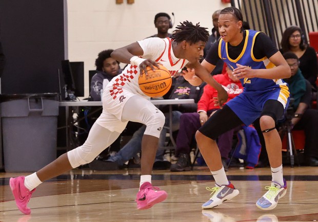 Rich Township's Al Brooks, Jr. (left) drives to the basket past Crete-Monee's Zion Gordon (right) during a basketball game in Richton Park on Friday, Feb. 14, 2025. (John Smierciak / Daily Southtown)