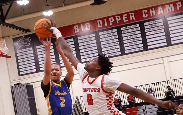 Rich Township's Al Brooks, Jr. (right) blocks a shot by Crete-Monee's Zion Gordon (left) during a basketball game in Richton Park on Friday, Feb. 14, 2025. (John Smierciak / Daily Southtown)