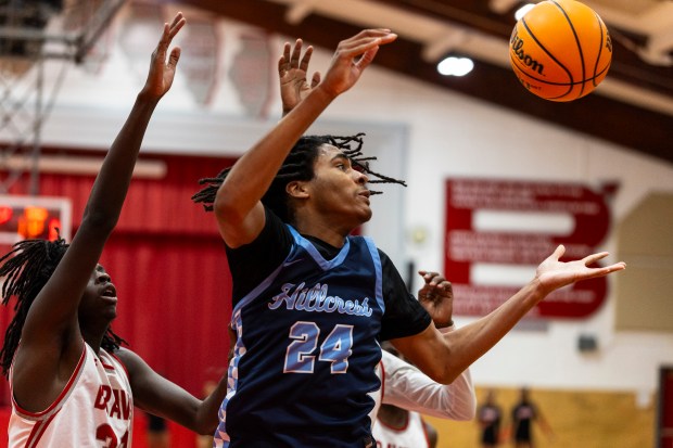 Hillcrest's Jaylen Ingram (24) reaches out for a rebound against Bremen during a South Suburban Conference game in Midlothian on Tuesday, Feb. 4, 2025. (Vincent D. Johnson / for the Daily Southtown)