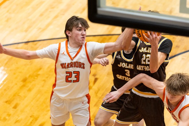 Lincoln-Way West's Wyatt Carlson (23) goes for a rebound during a nonconference game against Joliet Catholic in New Lenox on Saturday, Feb. 15, 2025. (Vincent D. Johnson / for the Daily Southtown)