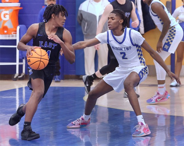 Bloom's Ethan Wilson (2) guards Lincoln-Way East's Jaymon Hornsby (11)during a basketball game in Chicago Heights on Monday, Feb.10, 2025 (John Smierciak / Daily Southtown)