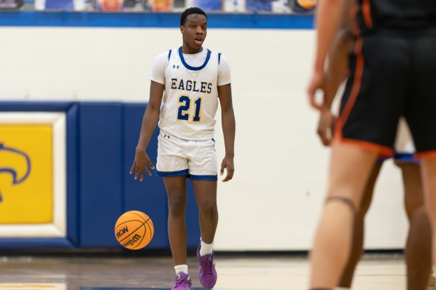 Sandburg's Daniel Morakinyo (21) brings the ball down court against Lincoln-Way West during a Southwest Suburban Conference game in Orland Park on Friday, Feb. 7, 2025. (Troy Stolt / for the Daily Southtown)