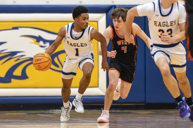 Sandburg's Malachi Perkins (1) brings the ball down court against Lincoln-Way West during a Southwest Suburban Conference game in Orland Park on Friday, Feb. 7, 2025. (Troy Stolt / for the Daily Southtown)