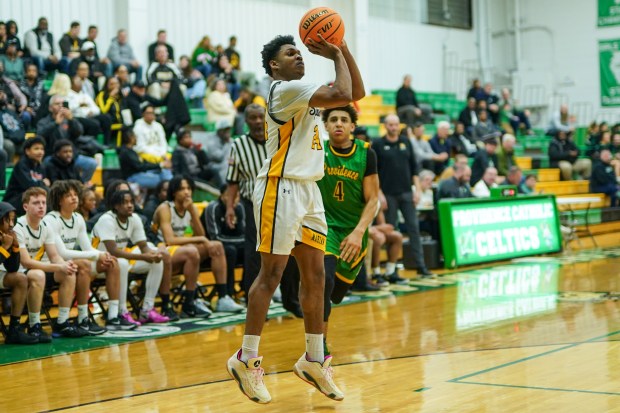 Marian Catholic's Delan Davis (24) shoots the ball on the wing against Providence's Kelechi Eniya (4) during a Class 3A Providence regional semifinal basketball game at Providence Catholic High School in New Lenox on Wednesday, Feb. 26, 2025. (Sean King / for The Daily Southtown)