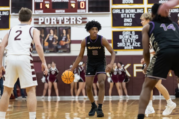 TF North's Dereon Smothers (7) brings the ball down court against Lockport during a non-conference game in Lockport on Friday, Feb. 21, 2025. (Troy Stolt / for the Daily Southtown)