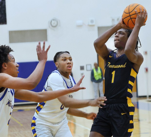 Thornwood's Jordan Jones (1) shoots over two Crete-Monee defenders during a basketball game in Crete on Friday, Feb. 21, 2025 (John Smierciak / Daily Southtown)