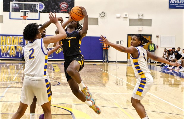 Thornwood's Jordan Jones (1) drives through three Crete-Monee defenders during a basketball game in Crete on Friday, Feb. 21, 2025 (John Smierciak / Daily Southtown)