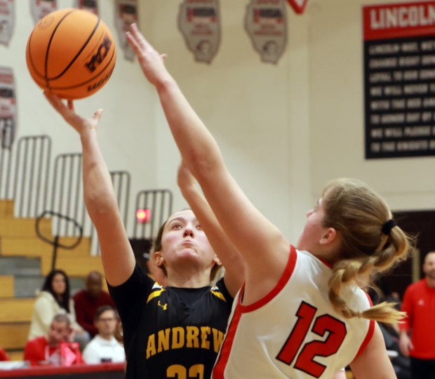 Andrew's Ana Cisek shoots for two as Lincoln-Way Central's Brooke Katzmann defends during the girls basketball game in New Lenox on Thursday, Feb. 6, 2025. (James C. Svehla / for the Daily Southtown)