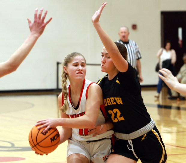 Andrew's Ana Cisek, right, puts the pressure on Lincoln-Way Central's Brooke Katzmann, left, during the girls basketball game in New Lenox on Thursday, Feb. 6, 2025. (James C. Svehla / for the Daily Southtown)