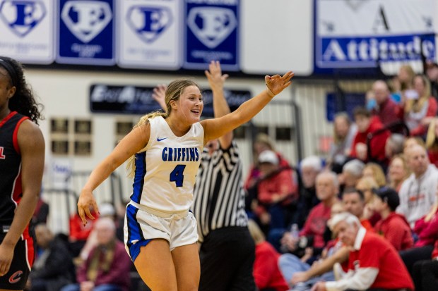 Lincoln-Way East's Alaina Vargas (4) smiles at East's student section after hitting a three pointer in the fourth quarter of the Class 4A Lincoln-Way East Regional semifinals against Lincoln-Way Central in Frankfort on Monday, Feb. 17, 2025. (Vincent D. Johnson / for the Daily Southtown)