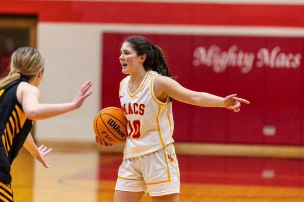 Mother McAuley's Delia Sullivan (10) works to position the Mighty Macs' offense against St. Laurence during a GCAC first-round playoff game in Chicago on Monday, Feb. 3, 2025. (Vincent D. Johnson / for the Daily Southtown)