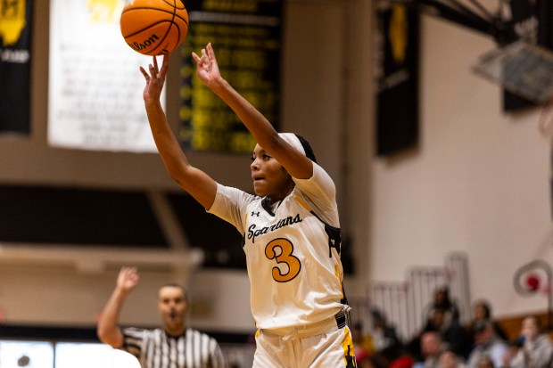 Marian Catholic's Taylor Bolton (3) takes a three-point attempt against St. Viator during an East Suburban Catholic game in Chicago Heights on Saturday, Feb.. 1, 2025. (Vincent D. Johnson / for the Daily Southtown)