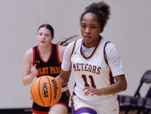 T.F. North's Natalie McGhee (11) drives down court against Tinley Park during the Class 3A T.F. North Regional semifinals on Monday, Feb.17, 2025 (John Smierciak / Daily Southtown)