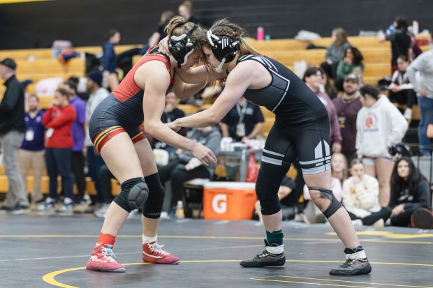 Batavia's Annabelle Guthke wrestles Oswego East's Ella Cooper during the 145 pound championship match of the Hinsdale South Regional on Saturday, Feb. 1, 2025. (Troy Stolt / for the Daily Southtown)