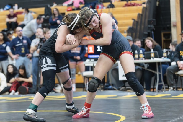 Batavia's Annabelle Guthke wrestles Oswego East's Ella Cooper during the 145 pound championship match of the Hinsdale South Regional on Saturday, Feb. 1, 2025. (Troy Stolt / for the Daily Southtown)