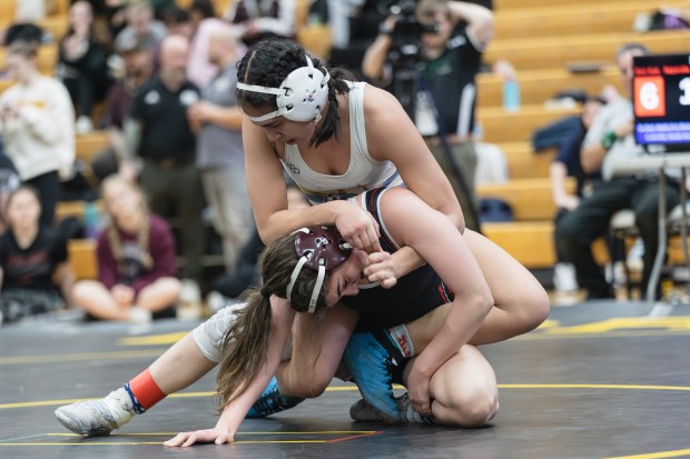 Lemont's Molly O'Connor wrestles Naperville Central's Desi Azar during the 125 pound championship match of the Hinsdale South Regional on Saturday, Feb. 1, 2025. (Troy Stolt / for the Daily Southtown)