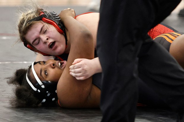 Shepard's Karrine Jenkins (bottom) is pinned by Marist's Abby Parker (top) in the 235 weight class during the Rich Township Regional wrestling match in Richton Park on Saturday, Feb.1, 2025 (John Smierciak / Daily Southtown)