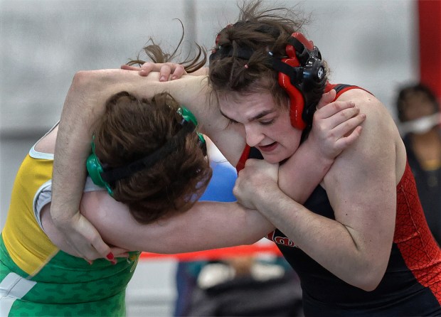 Marist's Sarah Parker (right) battles Ag Science's Elena Haugh (left) in the 170 pound weight class during the Rich Township Regional wrestling match in Richton Park on Saturday, Feb.1, 2025 (John Smierciak / Daily Southtown)