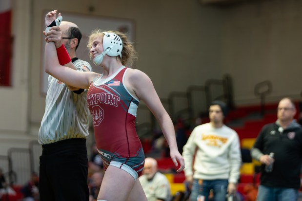 Claudia Heeney, right from Lockport, has her arm raised after beating Viola Pianetto from Prospect during their 135 lb final in the IHSA Girls Wrestling Schaumburg Sectional at Schaumburg High School on Saturday, Feb. 15, 2025 in Schaumburg, Illinois. ( John Konstantaras-Daily Southtown ) STA-L-GWR-SCHAUM-SECT-0217 ....7170-7179-250-51100-88888-76063