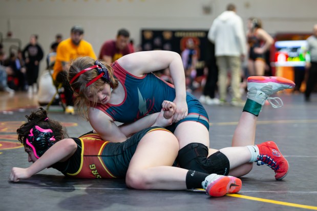 South Elgin's Allison Garbacz, top, works for a turn against Schaumburg's Madeline Zerafa-Lazarevi during their 145 lb final at the IHSA Girls Wrestling Schaumburg Sectional at Schaumburg High School on Saturday, Feb. 15, 2025 in Schaumburg, Illinois. Garbacz won the match. ( John Konstantaras-The Beacon-News ) STA-L-GWR-SCHAUM-SECT-0217....7170-7179-250-51100-88888-76063