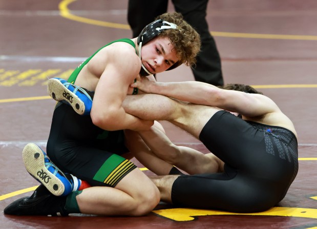 (150) Justus Heeg of Providence Catholic, left, and Ashton Hobson of Marmion Academy, right, during the 2025 Chicago Catholic League Championship wrestling tournament held at Montini Catholic High School in Lombard on Saturday, Jan. 25, 2025. (James C. Svehla / for the Daily Southtown)