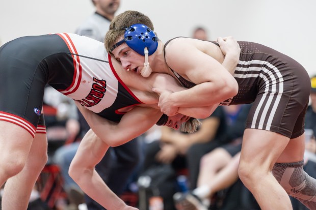 Joliet Catholic's Vince Tindal wrestles against Yorkville's Jack Ferguson in a 157 pound match during the Class 3A Yorkville Dual Team Sectional in Yorkville on Tuesday, Feb. 25, 2025. (Troy Stolt / for the Daily Southtown)