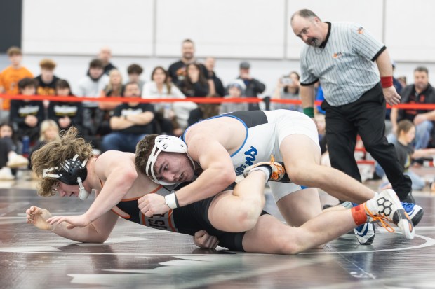 Lincoln-Way East's Colton Zvonar wrestles Lincoln-Way West's Jimmy Talley during the 190 pound championship match of the Class 3A Rich Township Regional in Richton Park on Saturday, Feb. 8, 2025. (Troy Stolt / for the Daily Southtown)